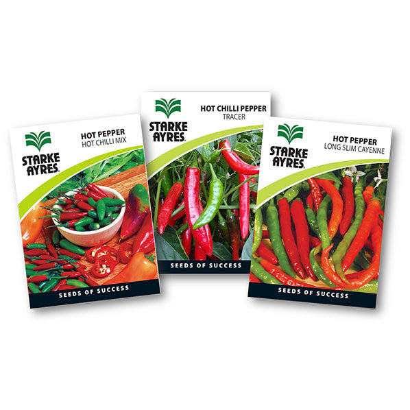 Three packages of Starke Ayres hot pepper seeds on a white background